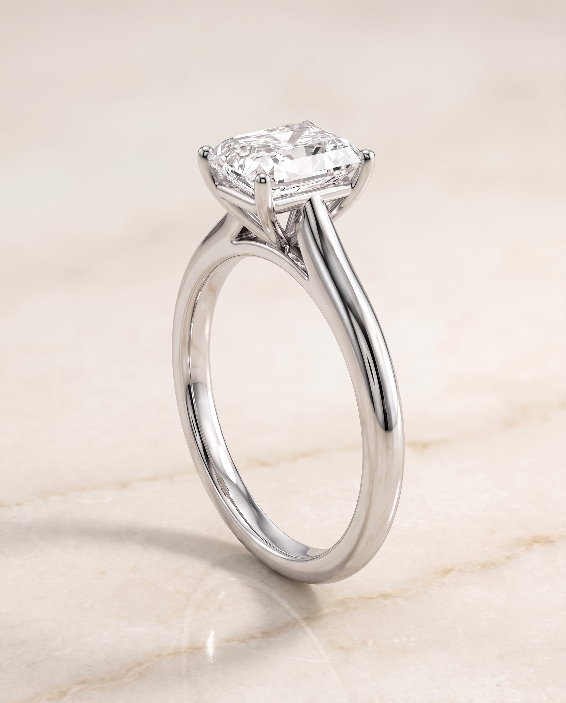 The Gladys Pinched Cathedral Solitaire Radiant Cut Engagement Ring Setting in 18K White Gold