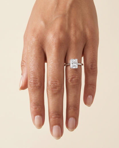 The Gladys Pinched Cathedral Solitaire Radiant Cut Engagement Ring Setting in 18K White Gold