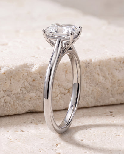 The Gladys Pinched Cathedral Solitaire Radiant Cut Engagement Ring Setting in 18K White Gold