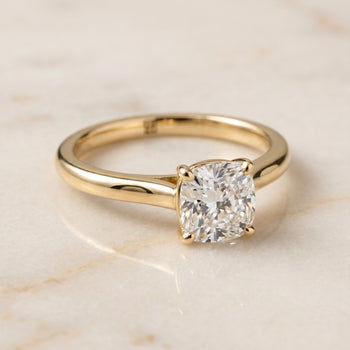 The Gladys Pinched Cathedral Solitaire Cushion Cut Engagement Ring Setting in 18K Yellow Gold