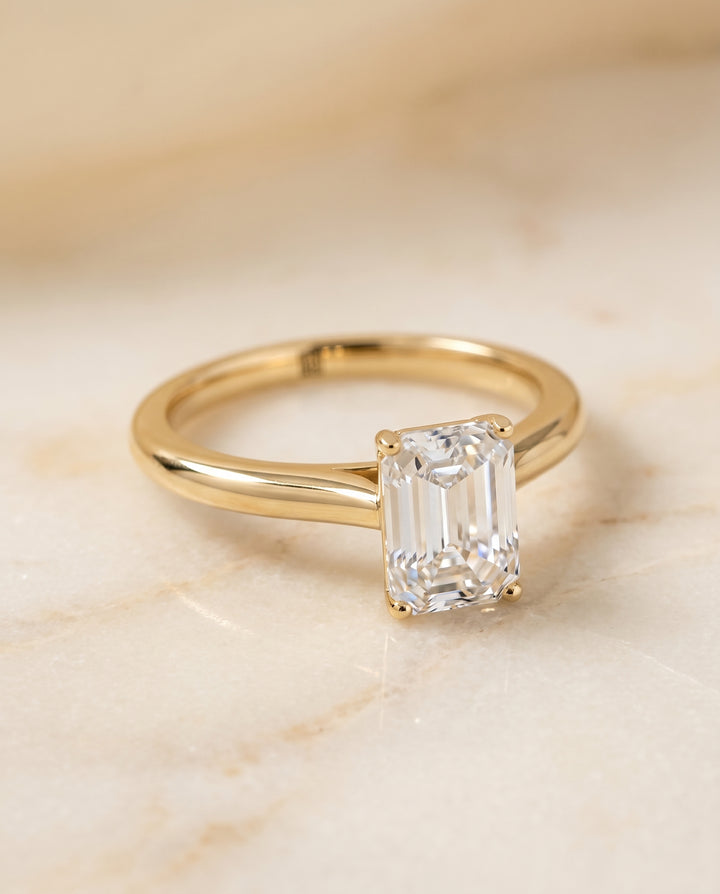 The Gladys Pinched Cathedral Solitaire Emerald Cut Engagement Ring Setting in 18K Yellow Gold