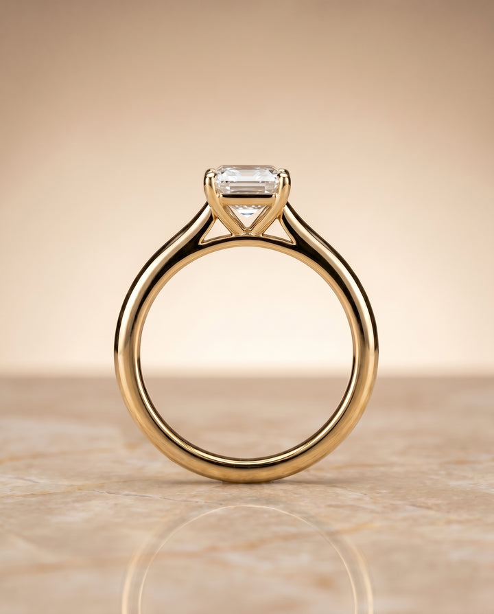 The Gladys Pinched Cathedral Solitaire Emerald Cut Engagement Ring Setting in 18K Yellow Gold