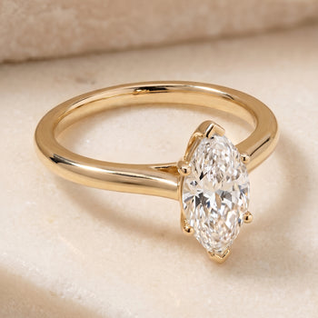The Gladys Pinched Cathedral Solitaire Marquise Engagement Ring Setting in 18K Yellow Gold