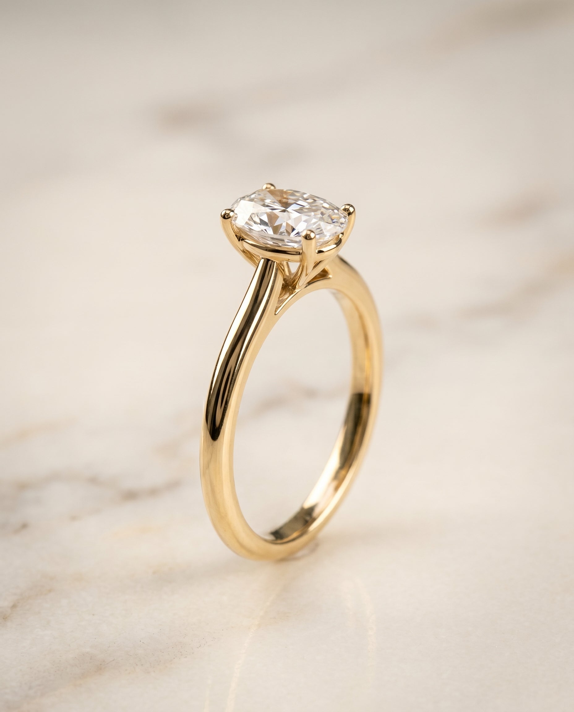 The Gladys setting for oval diamonds, made to order in 18K Yellow Gold | RockHer