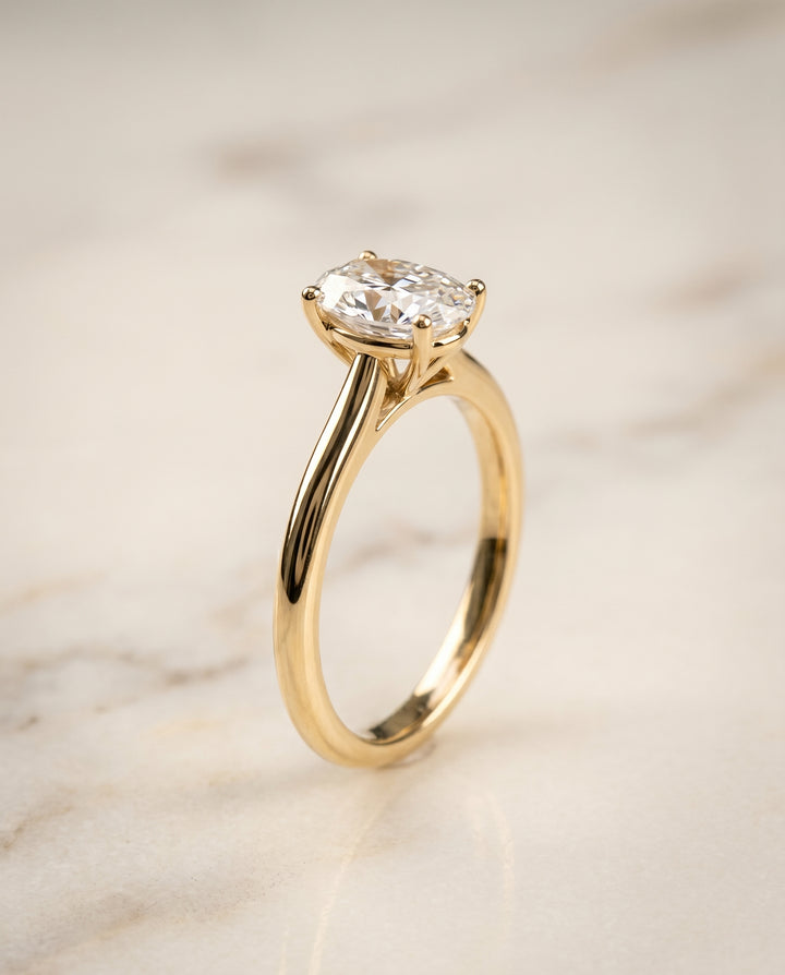 The Gladys Solitaire Engagement Ring Setting for Oval Diamonds in 18K Yellow Gold