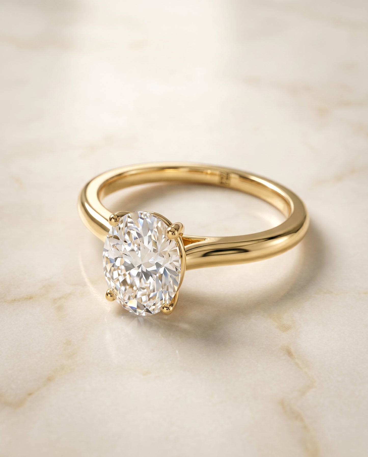 The Gladys Solitaire Engagement Ring Setting for Oval Diamonds in 18K Yellow Gold