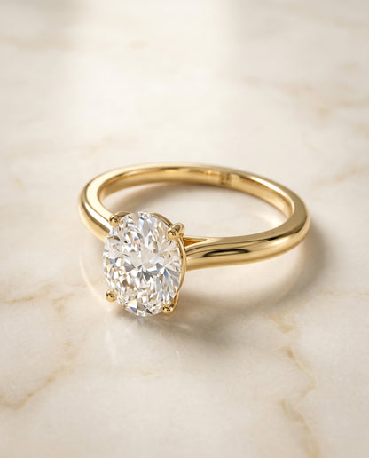 The Gladys Pinched Cathedral Solitaire Oval Engagement Ring Setting in 18K Yellow Gold