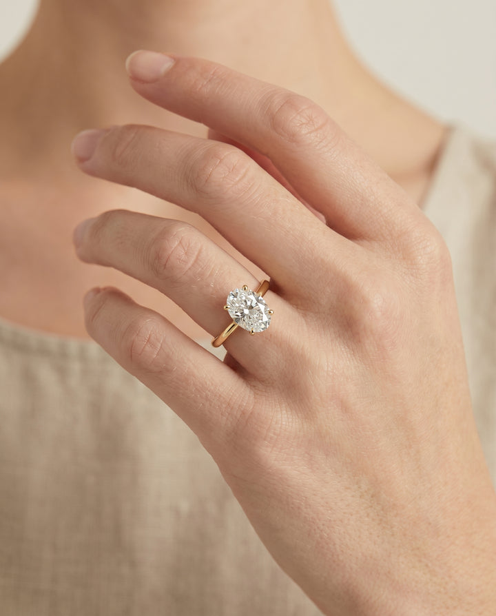 The Gladys Solitaire Engagement Ring Setting for Oval Diamonds in 18K Yellow Gold