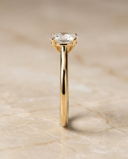 The Gladys Pinched Cathedral Solitaire Oval Engagement Ring Setting in 18K Yellow Gold
