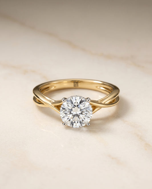The Grace Twisted Hidden Halo Solitaire Engagement Ring Setting for Round Diamonds in 18K Yellow Gold | RockHer