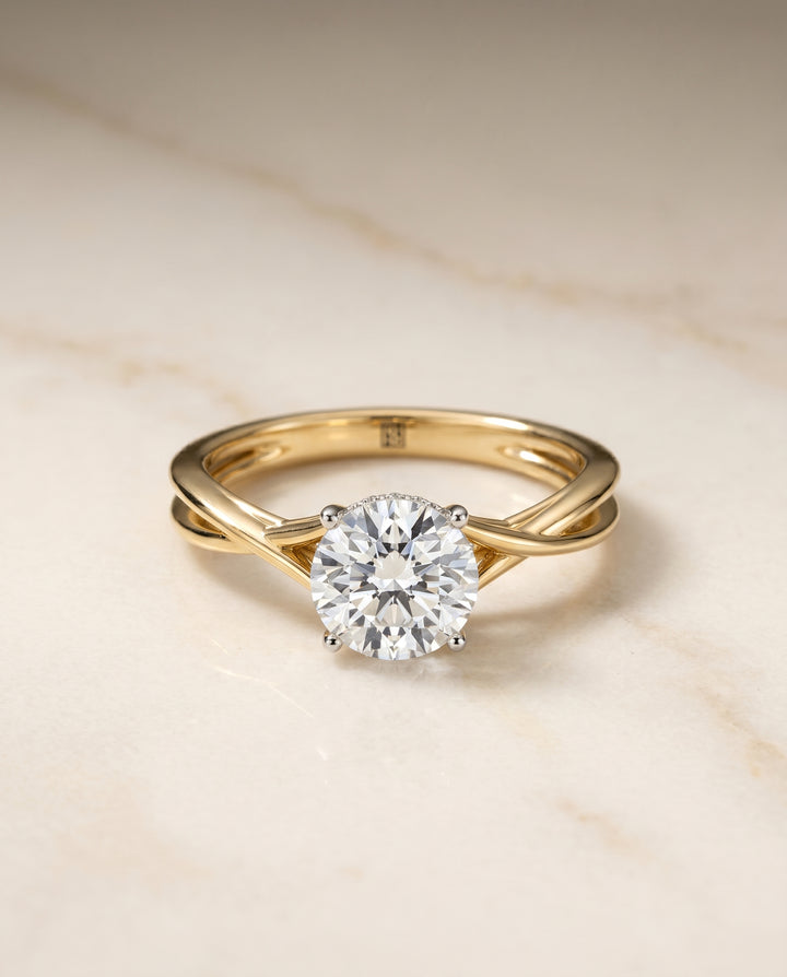 The Grace Twisted Hidden Halo Solitaire Engagement Ring Setting for Round Diamonds in 18K Yellow Gold | RockHer