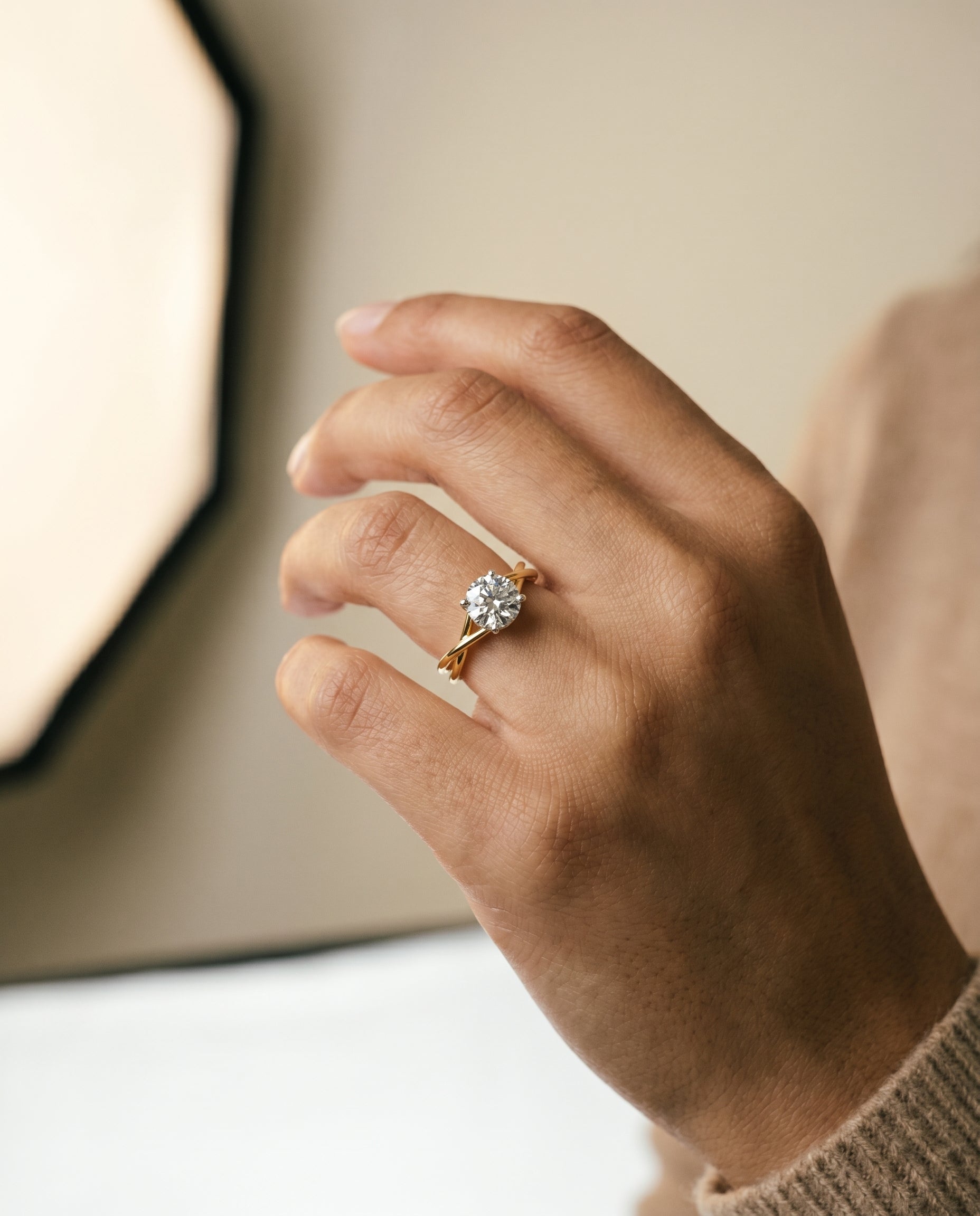 The Grace engagement ring setting in 18K Yellow Gold, select twisted shank hidden halo solitaire design | RockHer