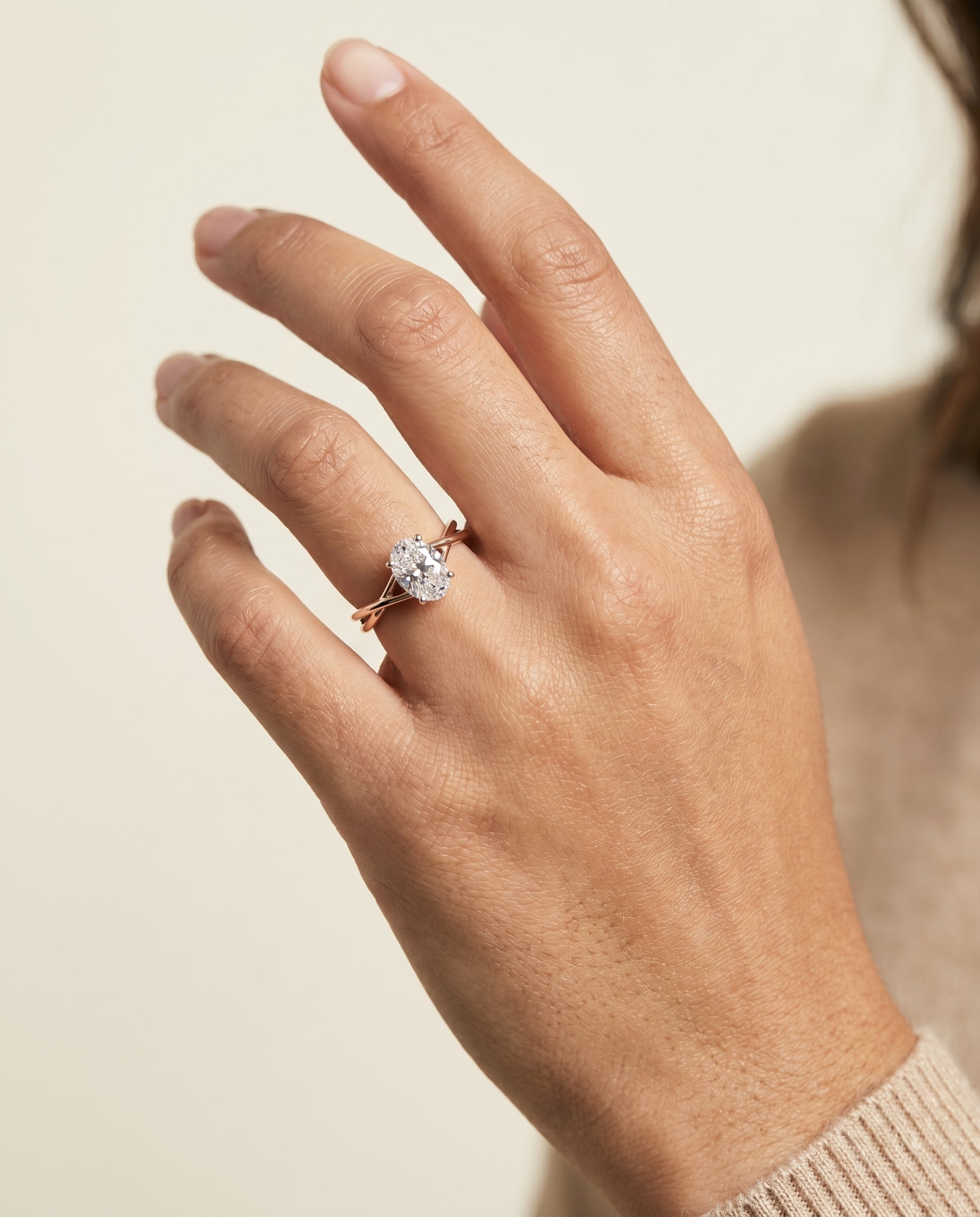 The Grace engagement ring setting in 14K Rose Gold, twisted shank hidden halo solitaire design | RockHer
