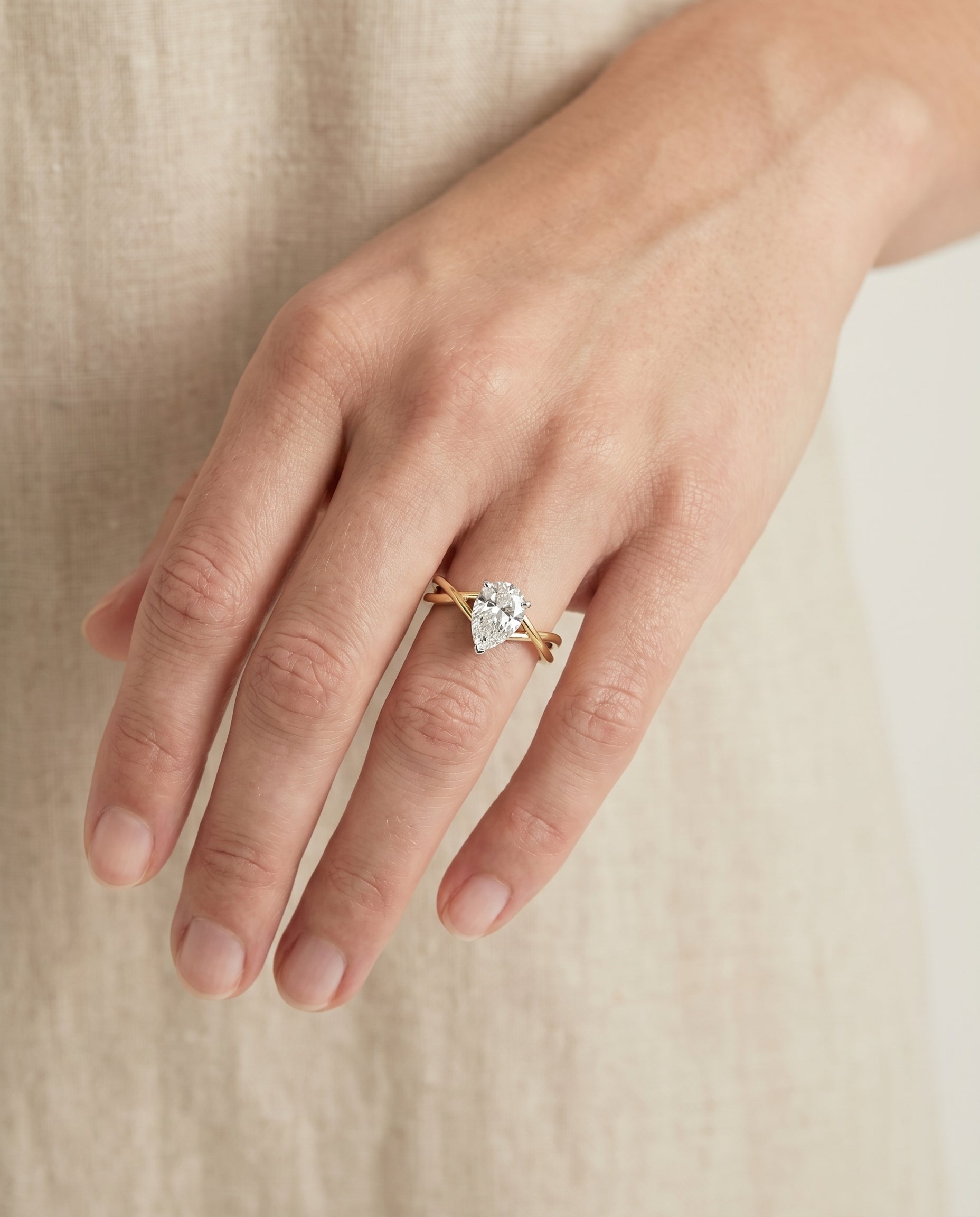 The Grace engagement ring setting in 18K Yellow Gold, twisted shank hidden halo solitaire design | RockHer