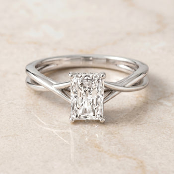 The Grace Twisted Shank Hidden Halo Solitaire Radiant Cut Engagement Ring Setting in 18K White Gold
