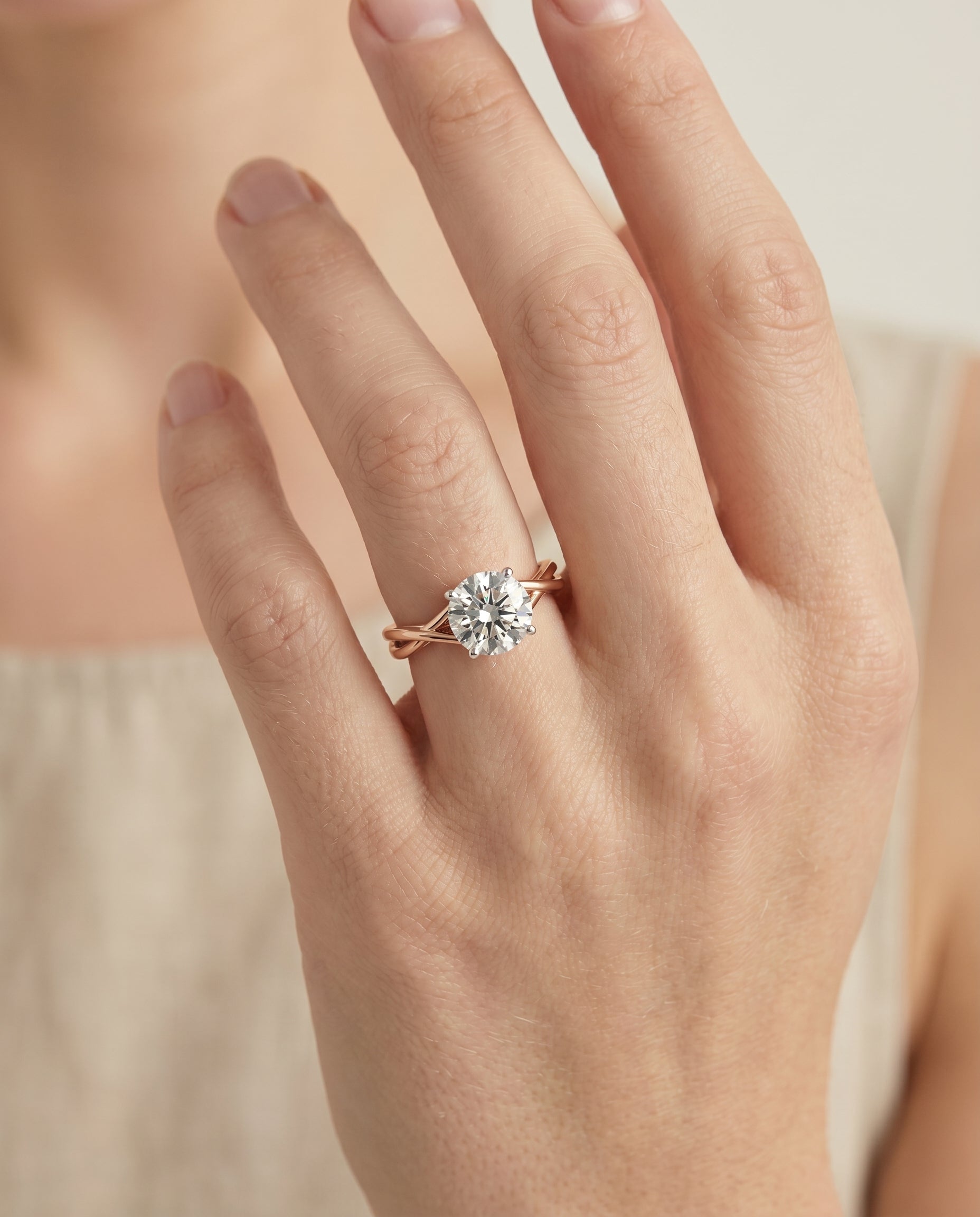 The Grace engagement ring setting in 14K Rose Gold, twisted shank hidden halo solitaire design | RockHer