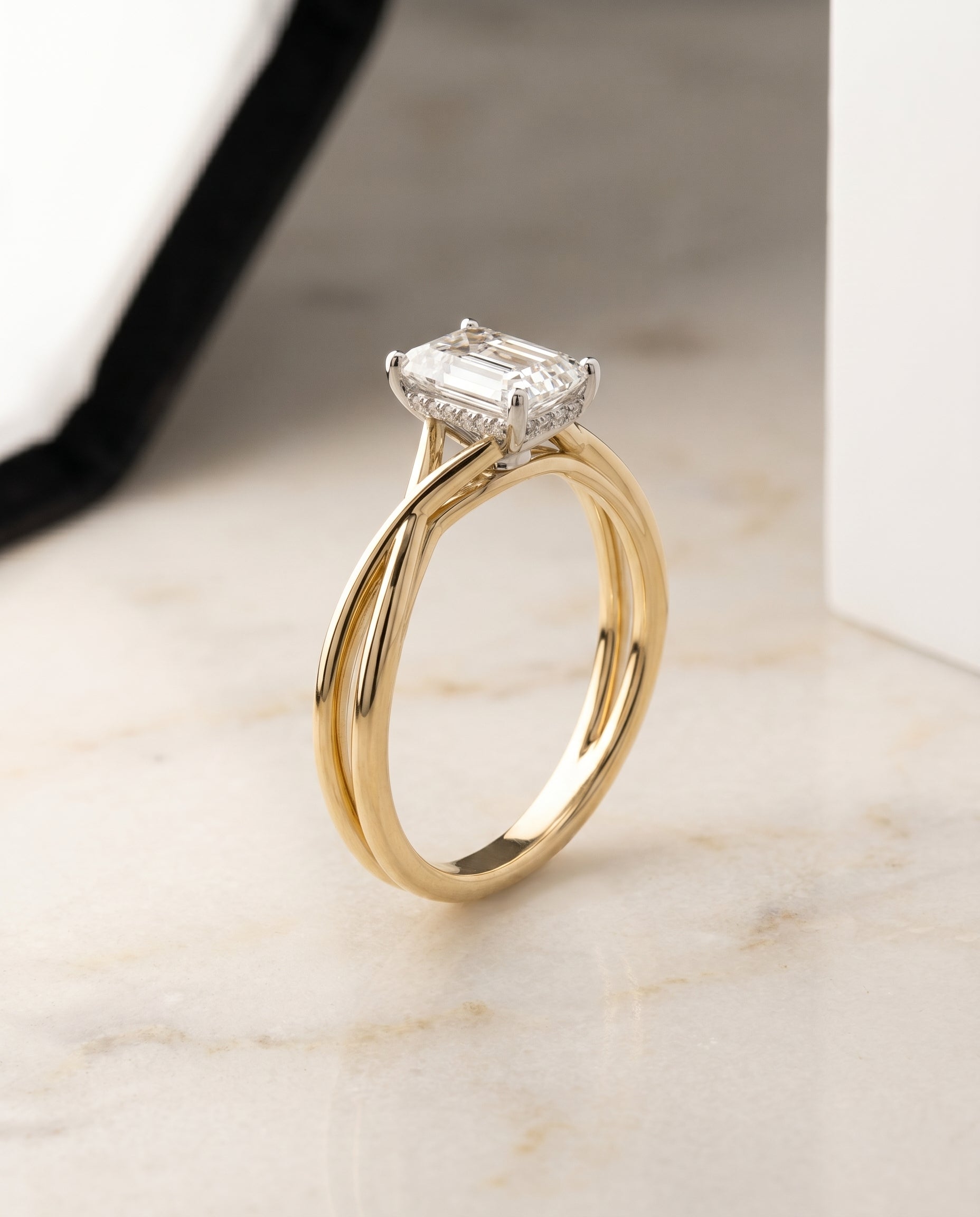 Twisted Shank Hidden Halo Solitaire Cut styling on The Grace emerald engagement ring setting | RockHer