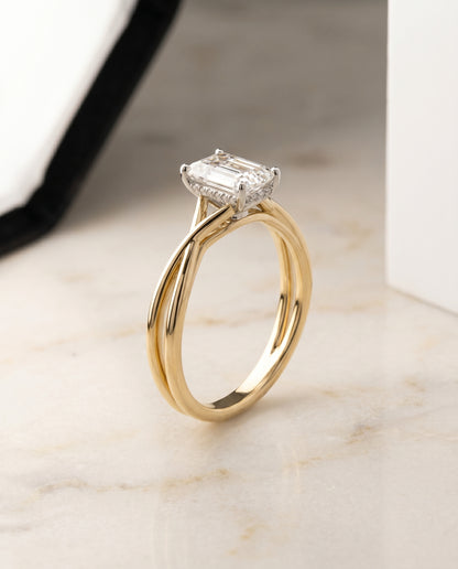 The Grace Twisted Shank Hidden Halo Solitaire Emerald Cut Engagement Ring Setting in 18K Yellow Gold