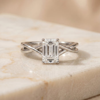 The Grace Twisted Shank Hidden Halo Solitaire Emerald Cut Engagement Ring Setting in Platinum