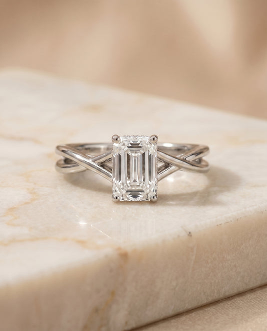 The Grace Twisted Hidden Halo Solitaire Engagement Ring Setting for Emerald Cut Diamonds in Platinum