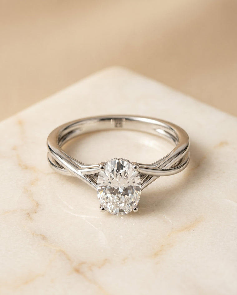 The Grace Twisted Shank Hidden Halo Solitaire Oval Engagement Ring Setting in 18K White Gold
