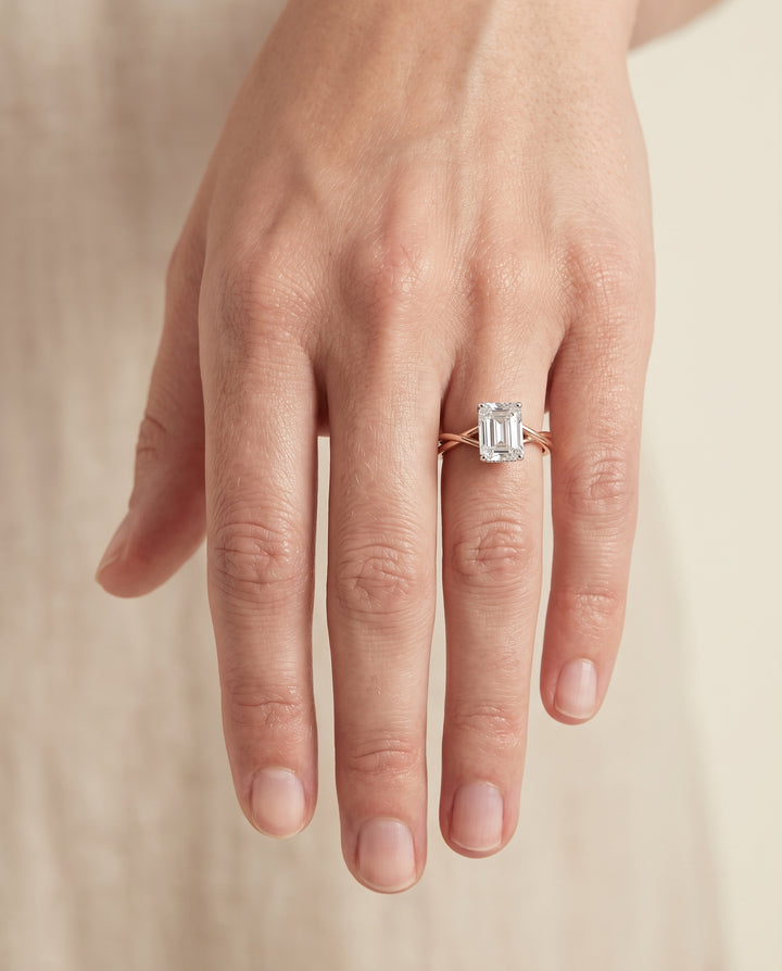 The Grace Twisted Shank Hidden Halo Solitaire Emerald Cut Engagement Ring Setting in 14K Rose Gold