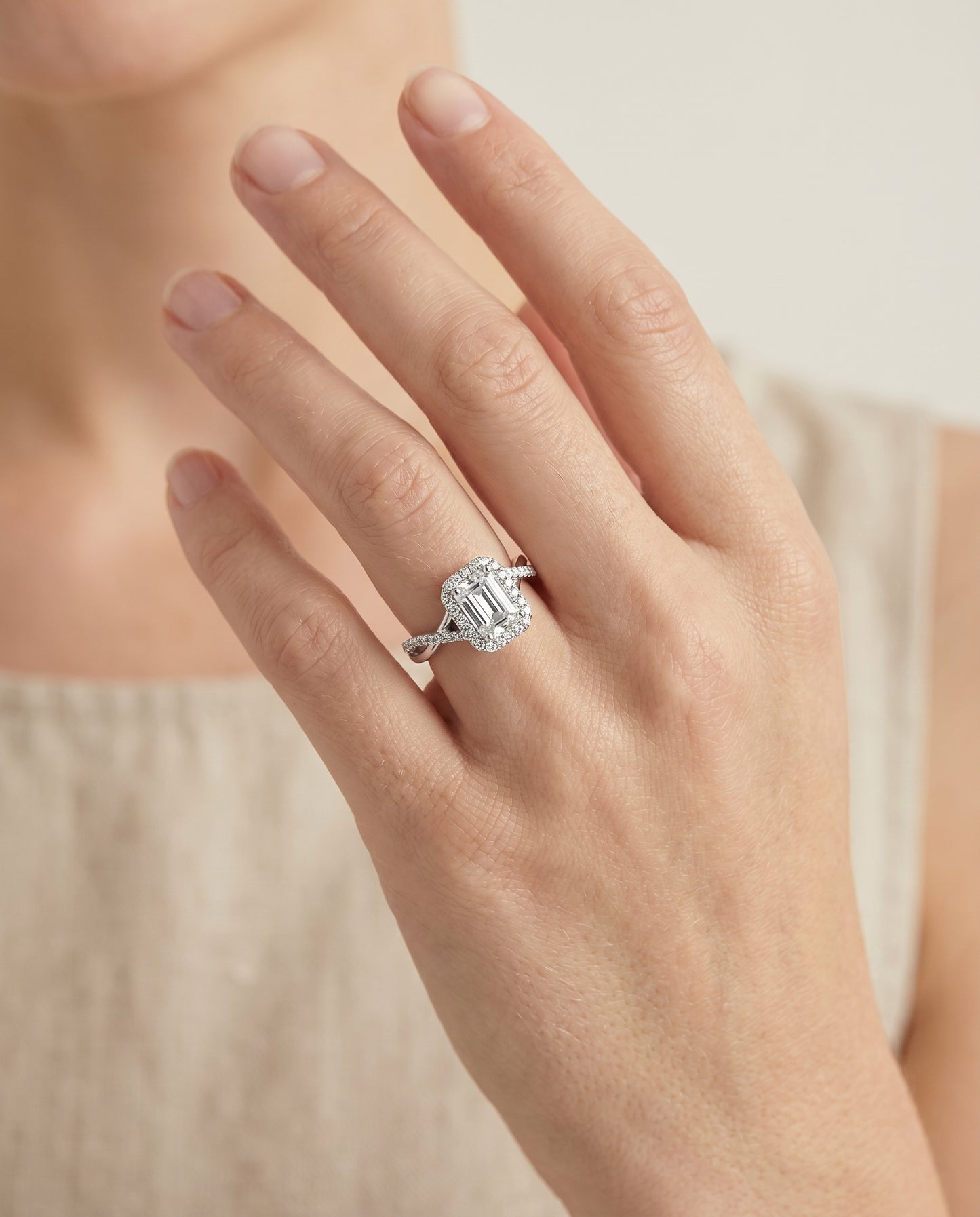 European Cut, Twisted Vine Halo Emerald, in Platinum, pave setting – lifestyle shot | RockHer