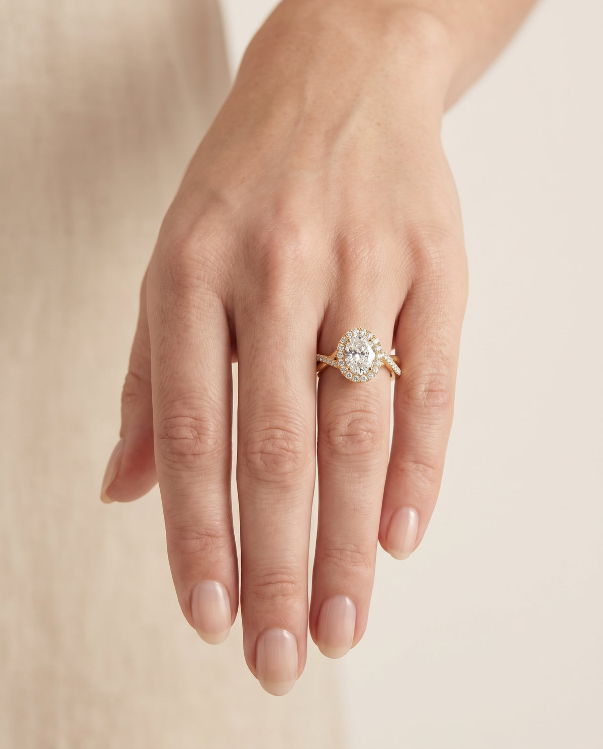 The Harmony Twisted Vine Halo Oval Engagement Ring Setting in 18K Yellow Gold