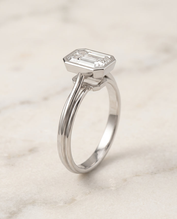 The Hayley Bezel Cathedral Solitaire Emerald Cut Engagement Ring Setting in Platinum