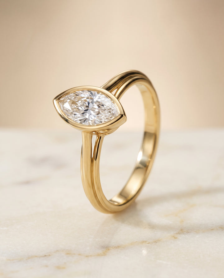 The Hayley Bezel Cathedral Solitaire Marquise Engagement Ring Setting in 18K Yellow Gold
