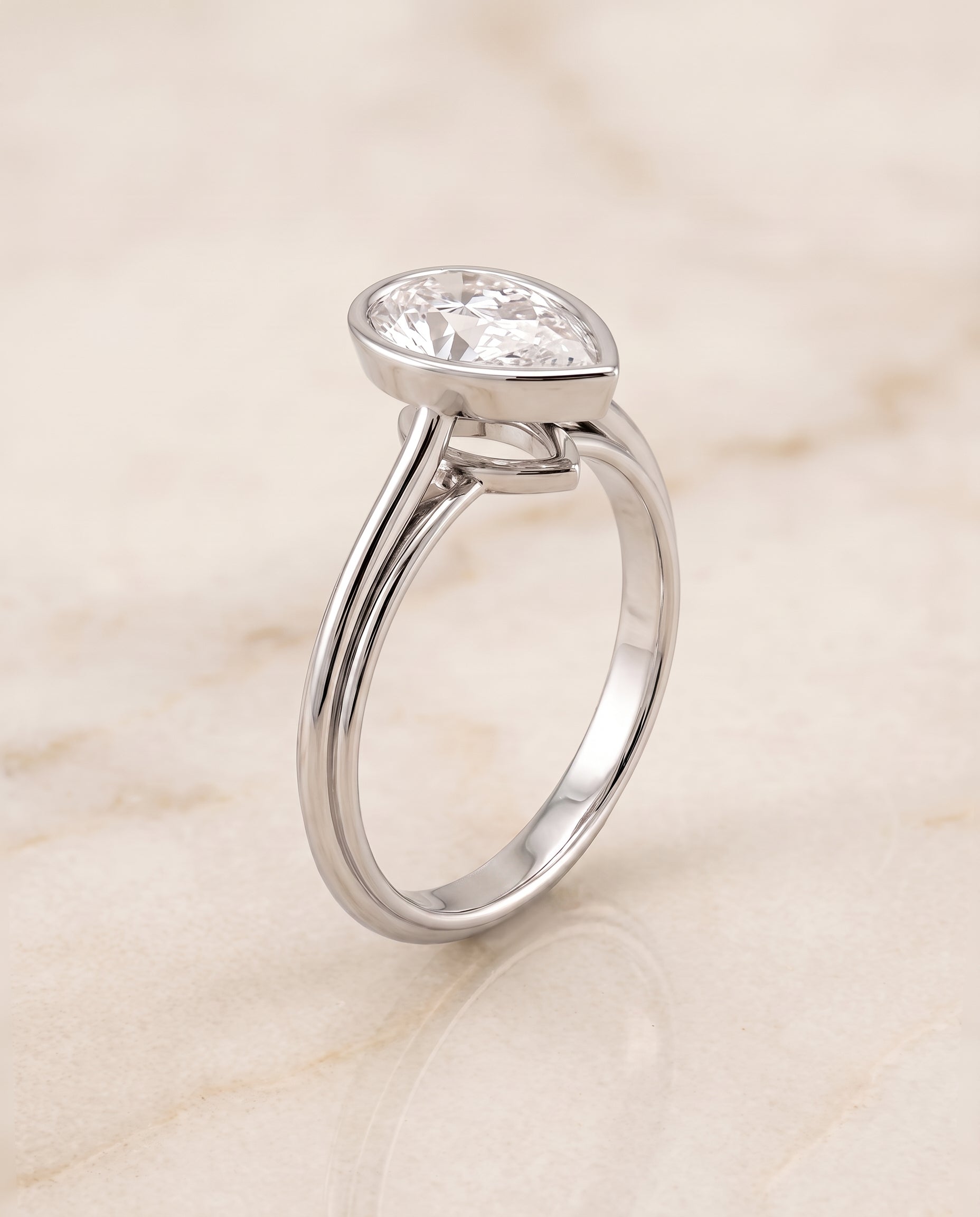 The Hayley Bezel Cathedral Solitaire Pear Engagement Ring Setting in Platinum