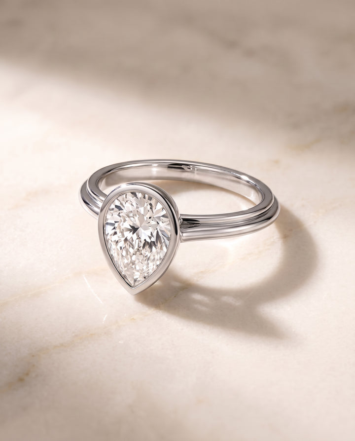 The Hayley Bezel Cathedral Solitaire Pear Engagement Ring Setting in Platinum