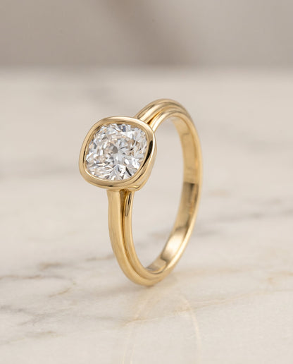 Hayley Select Bezel Solitaire Cushion Cut Lab Diamond Engagement Ring in 18K Yellow Gold, front view | RockHer