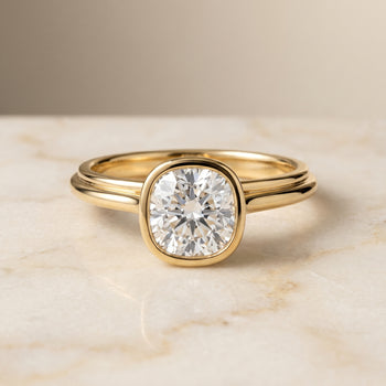 The Hayley Bezel Cathedral Solitaire Cushion Cut Engagement Ring Setting in 18K Yellow Gold
