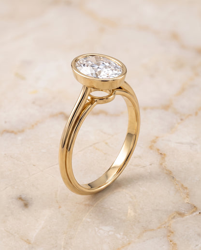 The Hayley Bezel Cathedral Solitaire Oval Engagement Ring Setting in 18K Yellow Gold