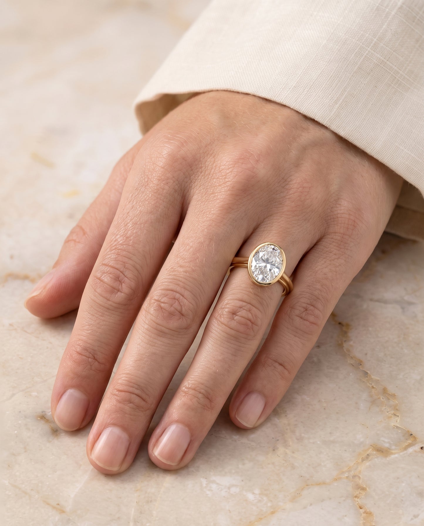 The Hayley Bezel Cathedral Solitaire Oval Engagement Ring Setting in 18K Yellow Gold