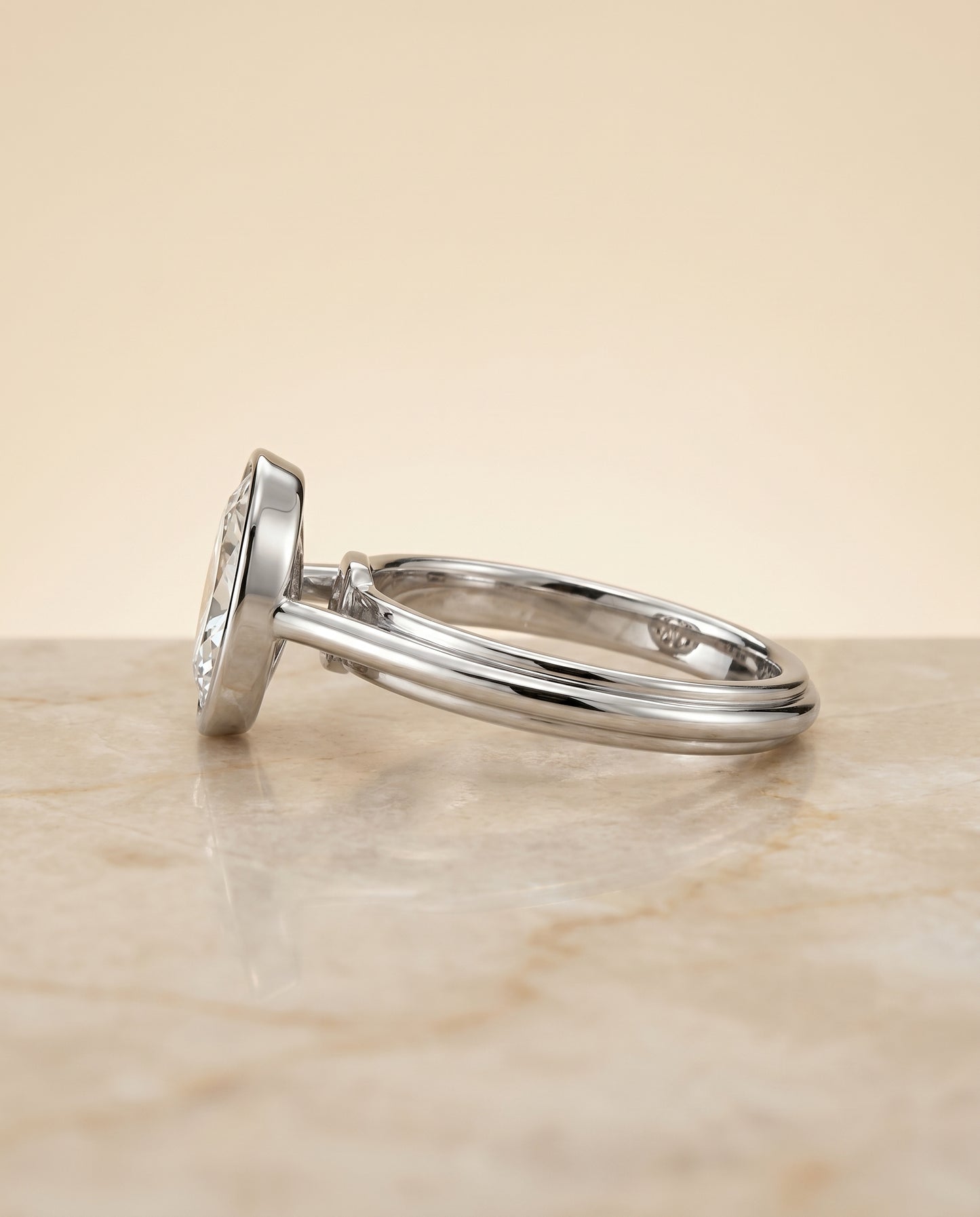 The Hayley Bezel Solitaire Engagement Ring Setting for Oval Diamonds in Platinum