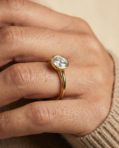 Hayley Select Bezel Solitaire Round Lab Diamond Engagement Ring in 18K Yellow Gold, shown on hand | RockHer