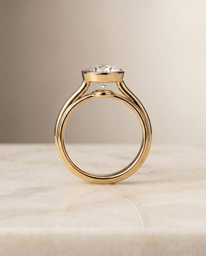 The Hayley Bezel Cathedral Solitaire Round Engagement Ring Setting in 18K Yellow Gold