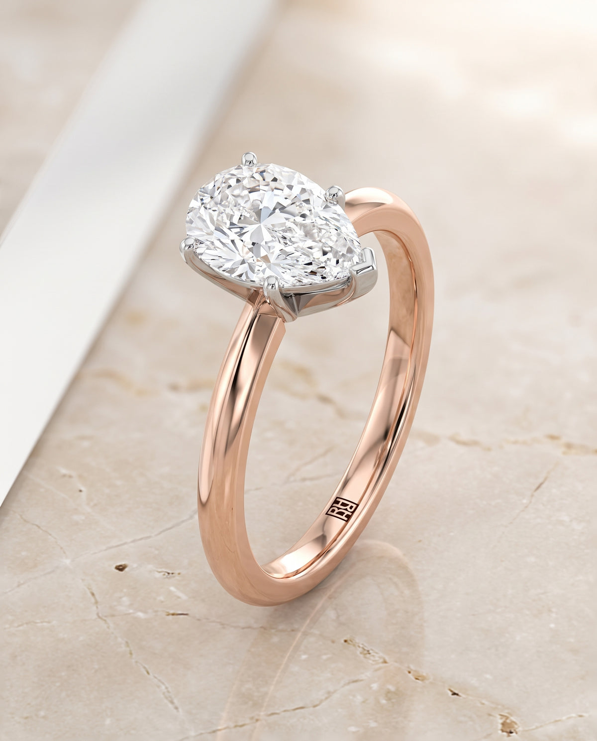 The Isolde Petite Knife Edge Solitaire Pear Engagement Ring Setting in 14K Rose Gold