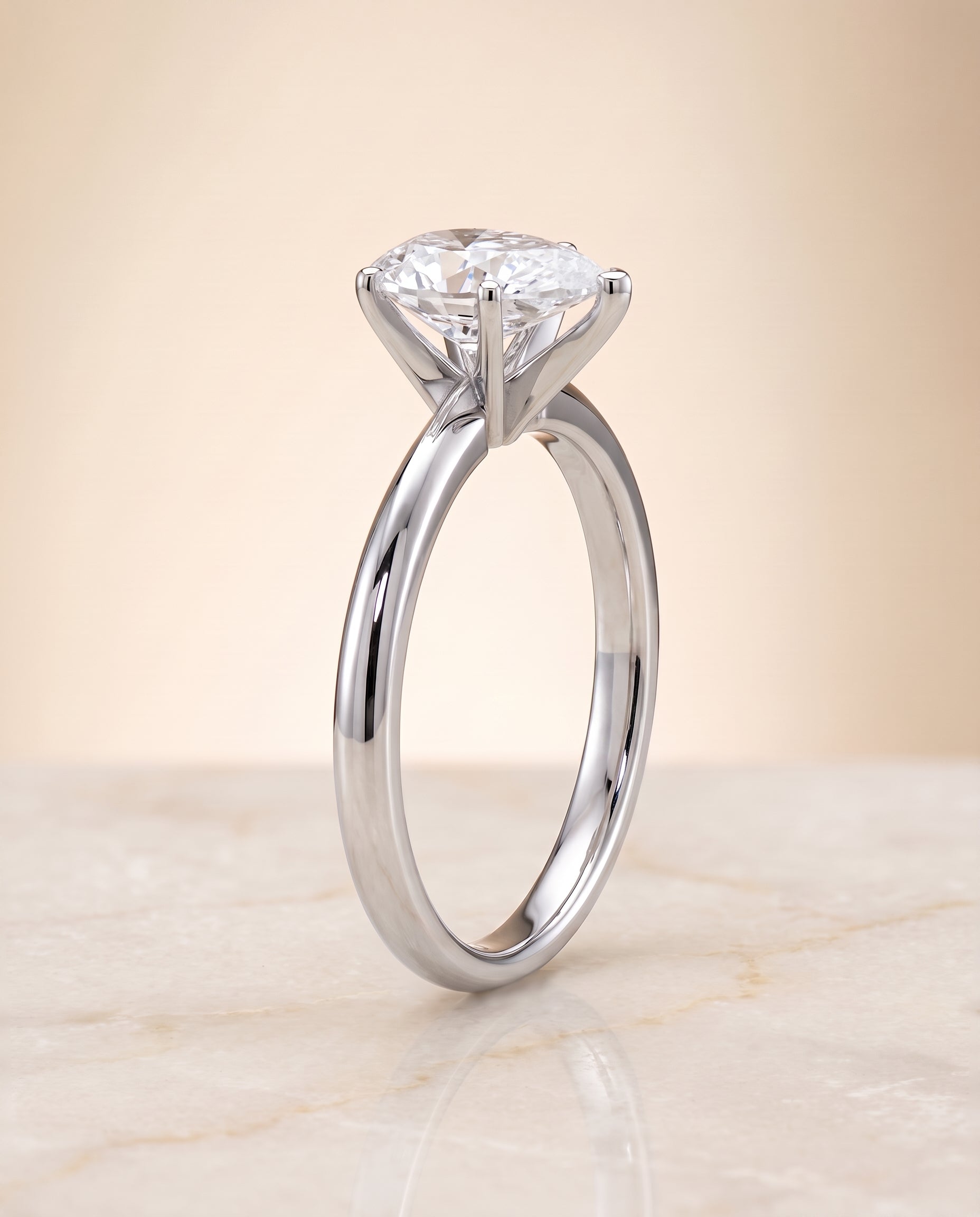 Petite Knife Edge Solitaire styling on The Isolde pear engagement ring setting | RockHer
