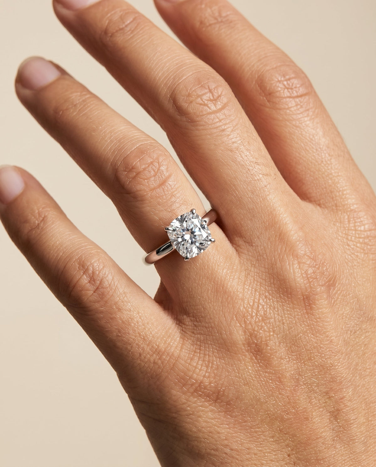 Isolde Select Knife Edge Solitaire Cushion Cut Lab Diamond Engagement Ring in 18K White Gold, shown on hand | RockHer