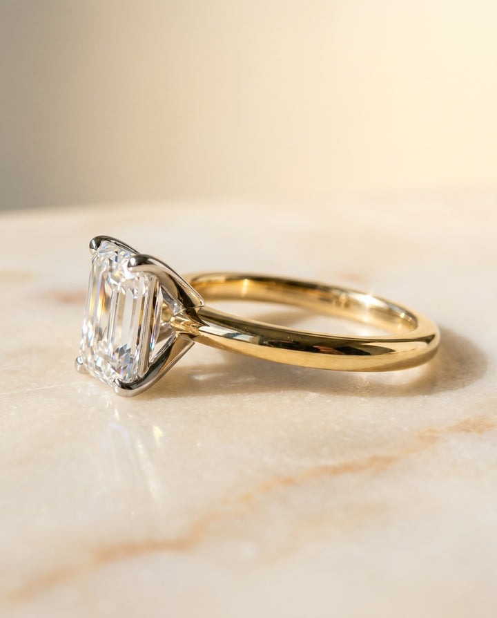 The Isolde Petite Knife Edge Solitaire Emerald Cut Engagement Ring Setting in 18K Yellow Gold