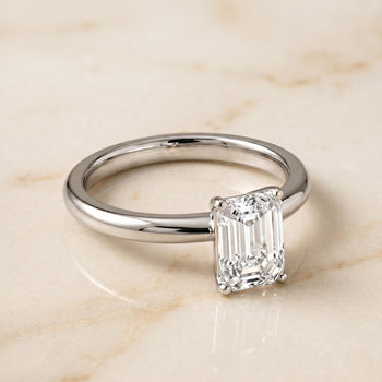 The Isolde Petite Knife Edge Solitaire Emerald Cut Engagement Ring Setting in 18K White Gold