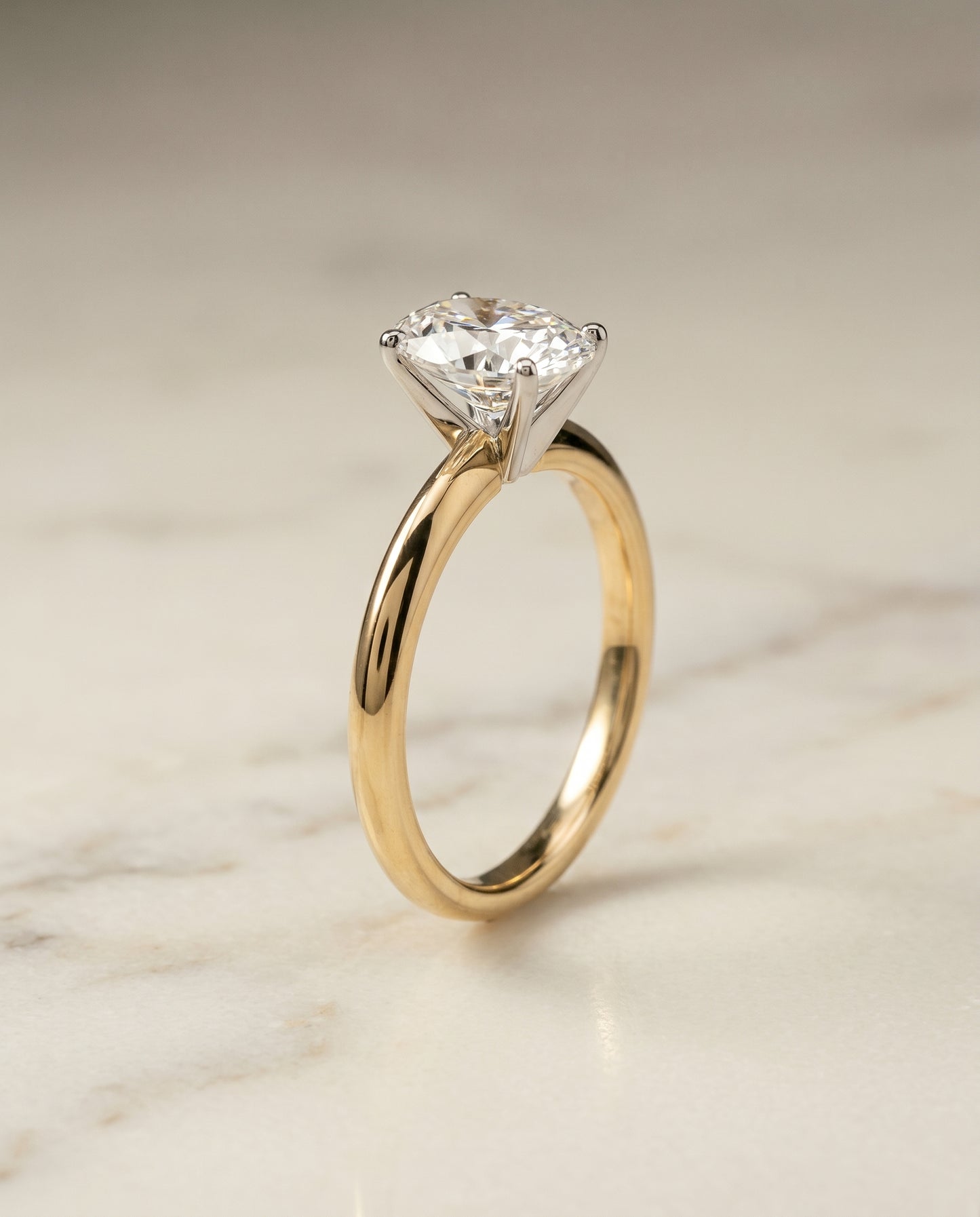 The Isolde Solitaire Engagement Ring Setting for Oval Diamonds in 18K Yellow Gold