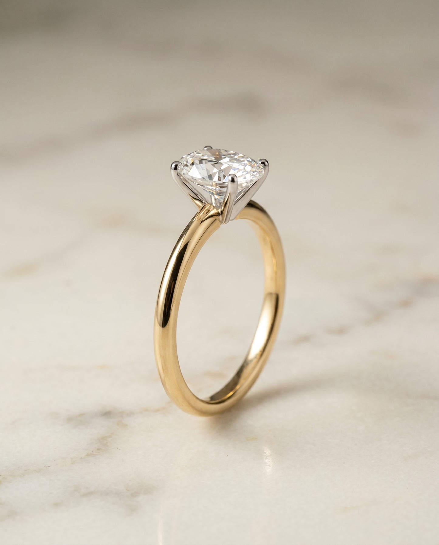 The Isolde Solitaire Engagement Ring Setting for Oval Diamonds in 18K Yellow Gold