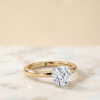 The Isolde Petite Knife Edge Solitaire Round Engagement Ring Setting in 18K Yellow Gold