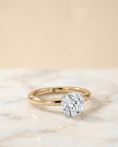 The Isolde Petite Knife Edge Solitaire Round Engagement Ring Setting in 18K Yellow Gold