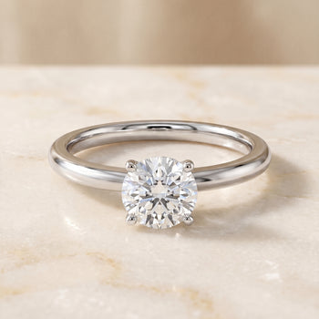 The Isolde Petite Knife Edge Solitaire Round Engagement Ring Setting in 18K White Gold
