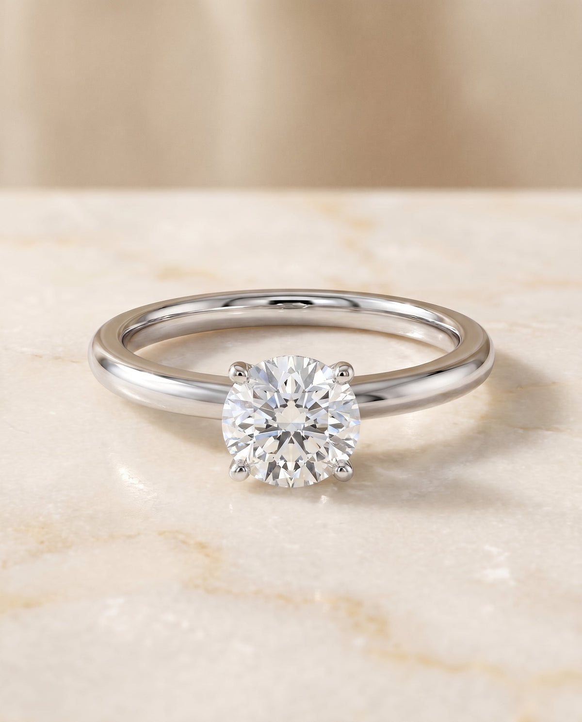 Isolde Select Knife Edge Solitaire Round Lab Diamond Engagement Ring in Platinum, shown on hand, angled | RockHer
